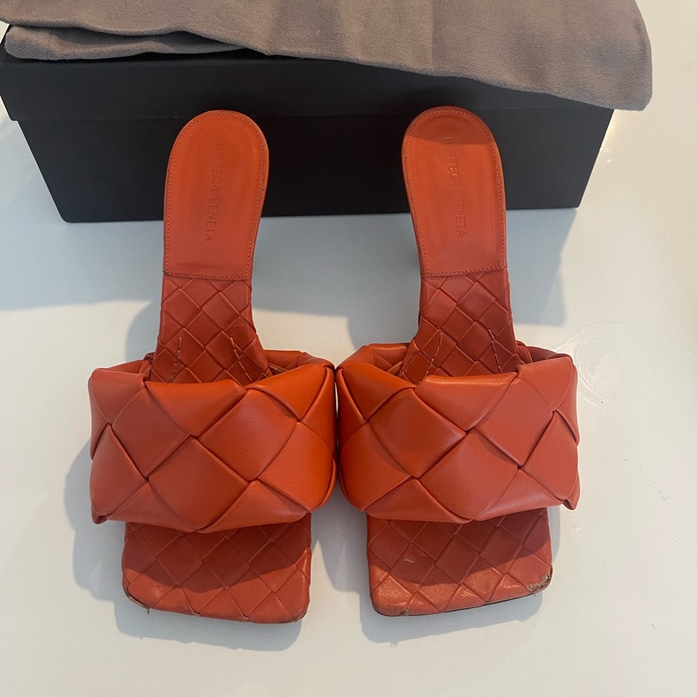 Orange Bottega Veneta heels.